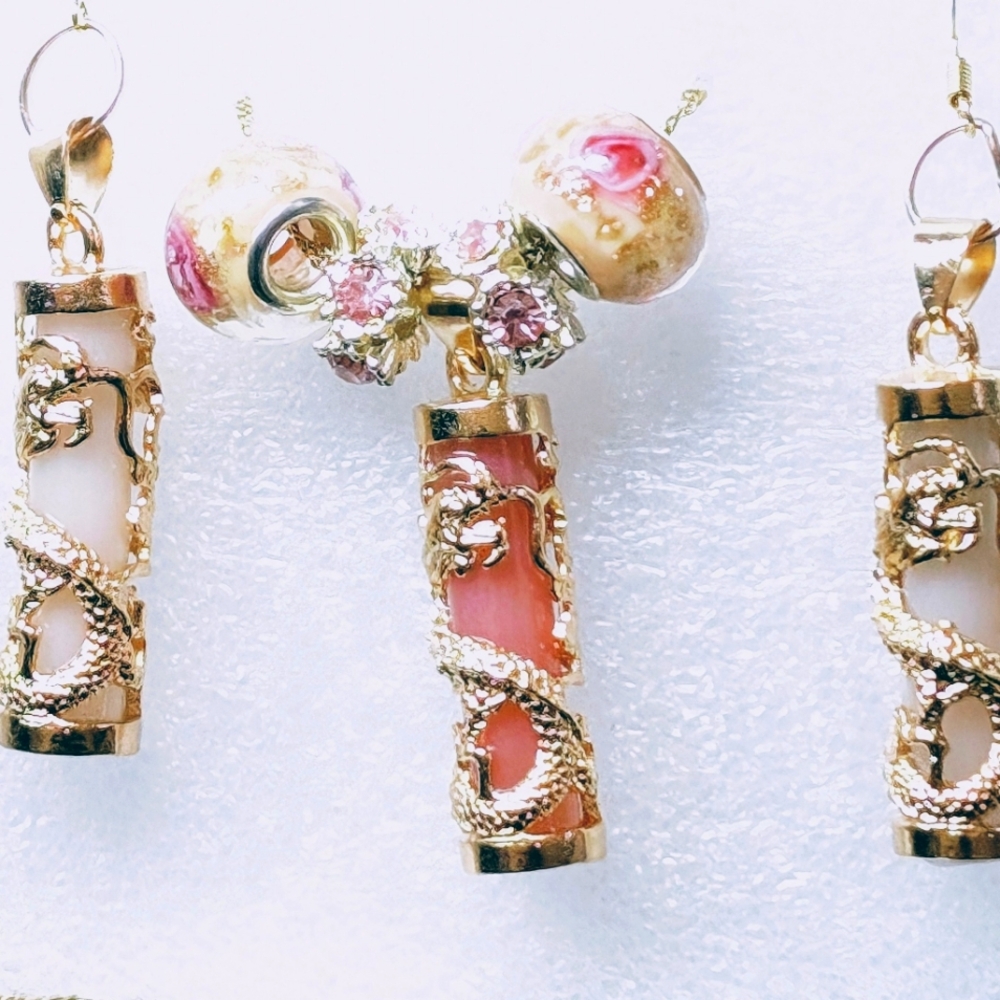 Intricate Gold and Pink Glow In The Dark Earrings with Cylindrical Design